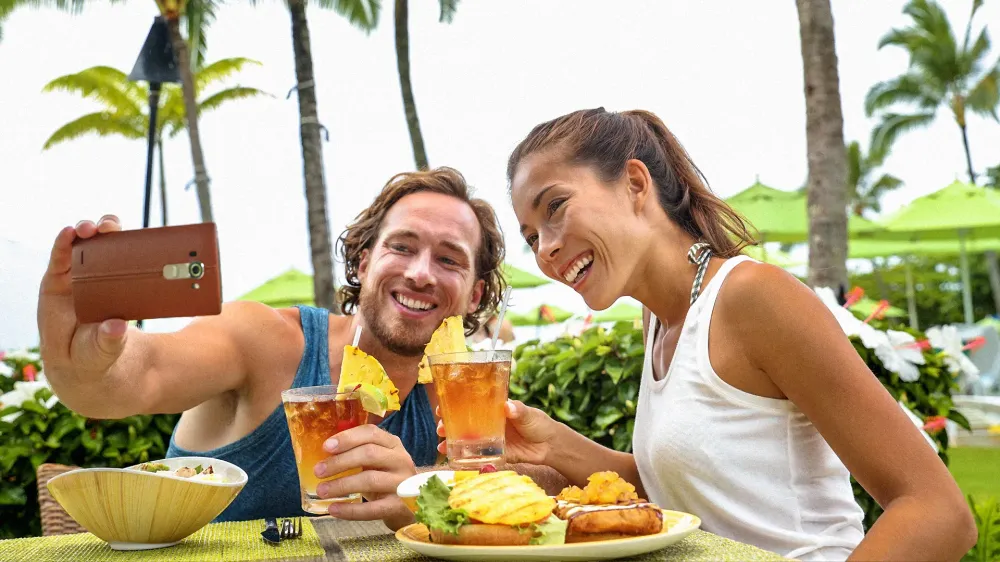 couple toasting cheers with alcoholic hawaiian drinks, Mai Tai, Hawaii